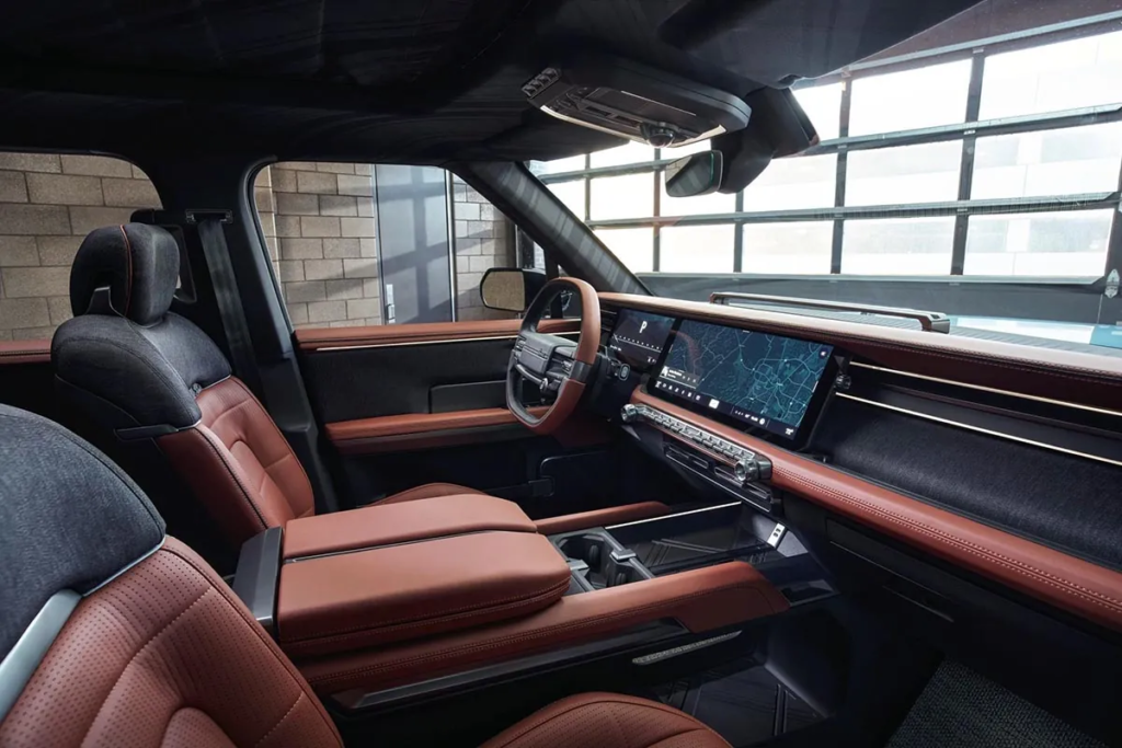 The driver's cockpit combines robustness and modernity with a large central screen, touch controls, and durable materials suitable for off-road use. © Scout/Audi